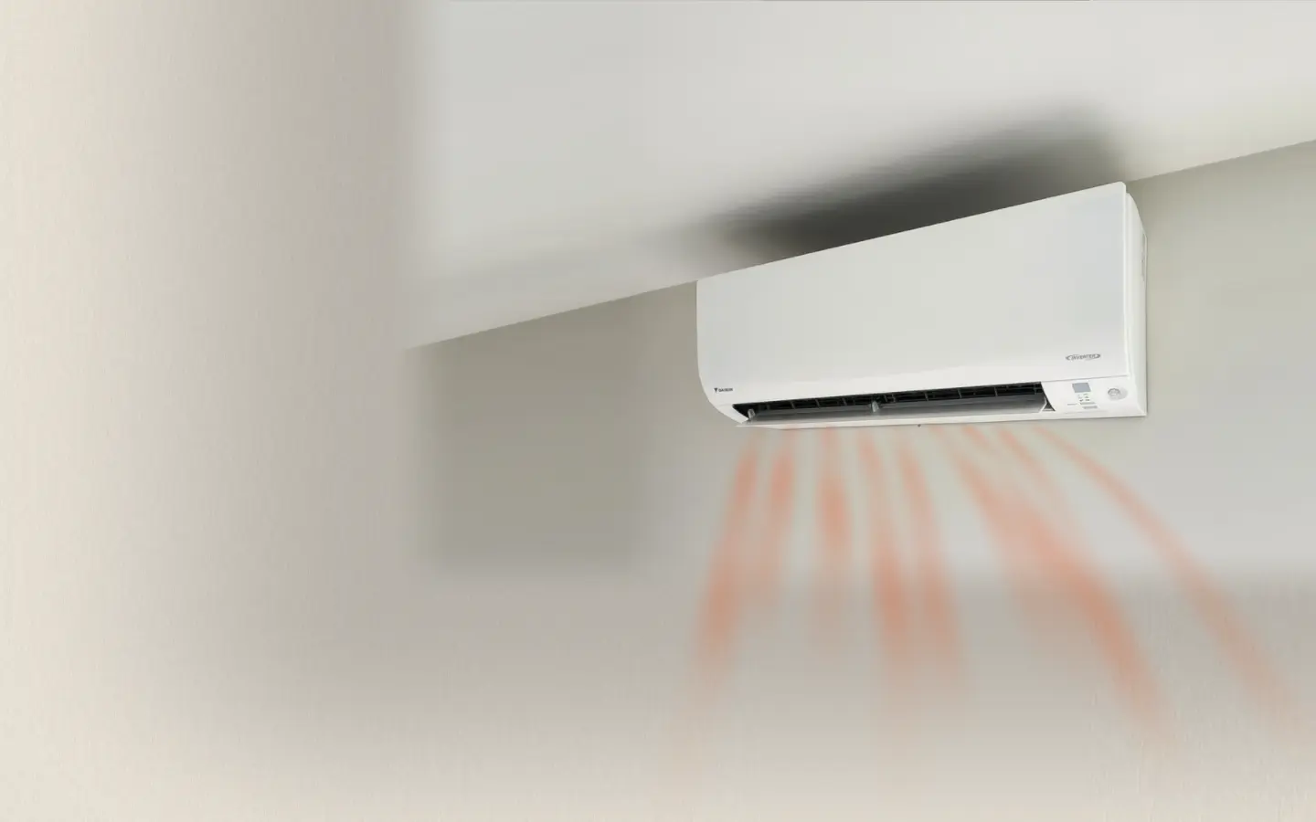 A Daikin wall-mounted indoor heat pump unit on a plain white wall